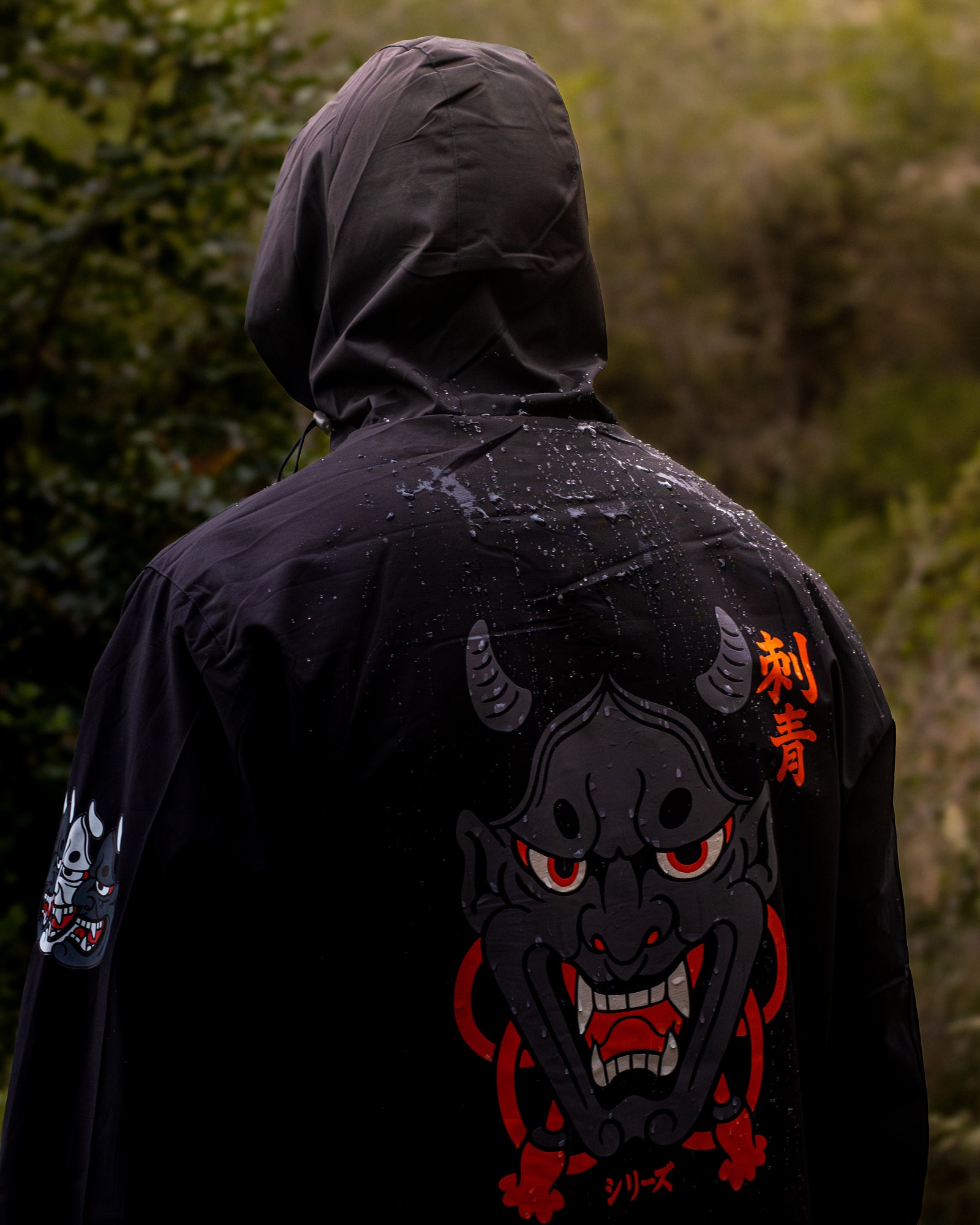 Black Hanya Windbreaker with hood up and oni graphic — STAY WILD